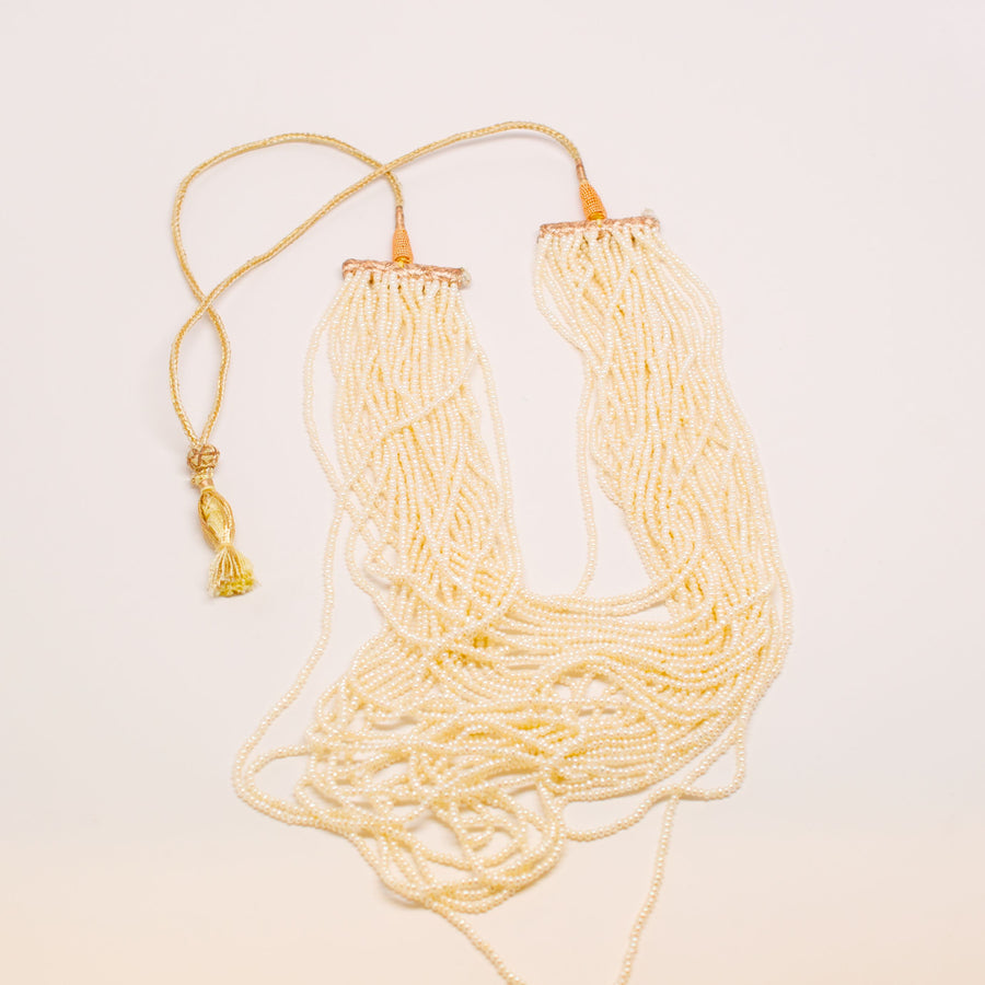 Indian multi strand natural seed pearl Necklace With Gold Wovern Cord